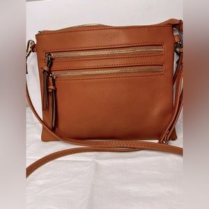 Cognac cross body bag with animal print interior- EUC